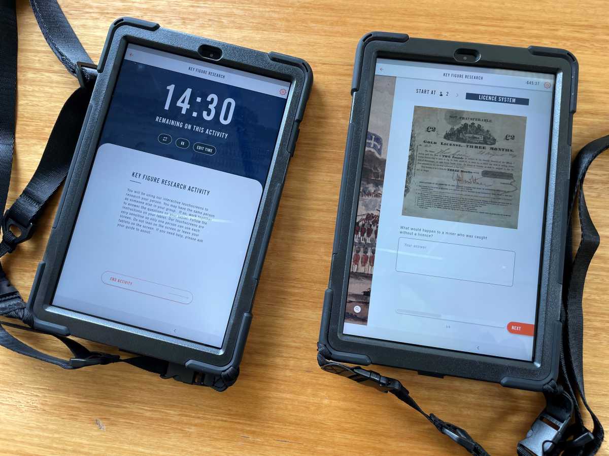 Two tablets with education program content showing